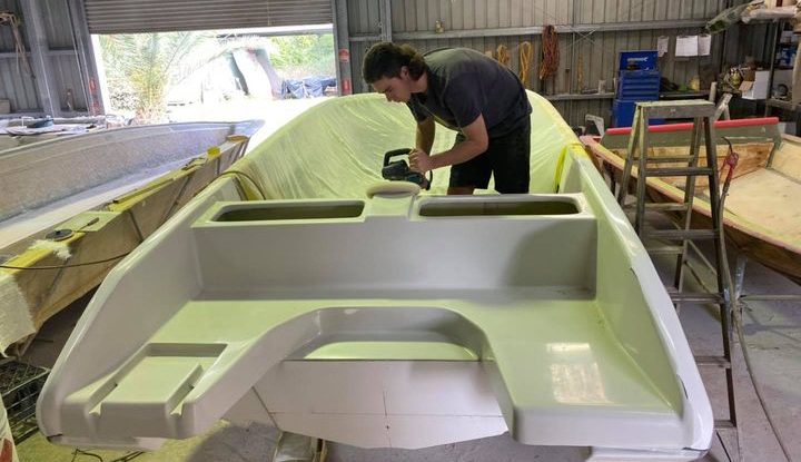 Check out the all new F24 outboard rear boarding and swim area!   One of our apprentices, Bejay, is putting the final touches on as it takes shape ready for the moulding process.